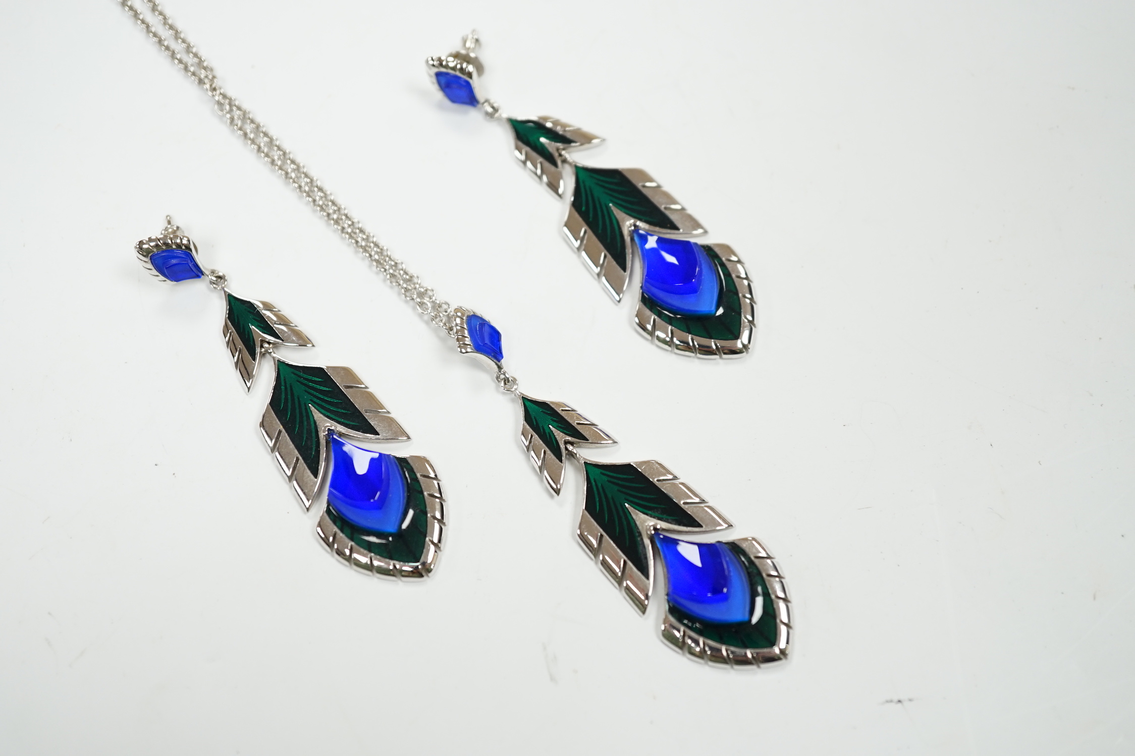 A modern Lalique 925, enamel and glass set pendant necklace, 66cm and a pair of matching earrings.